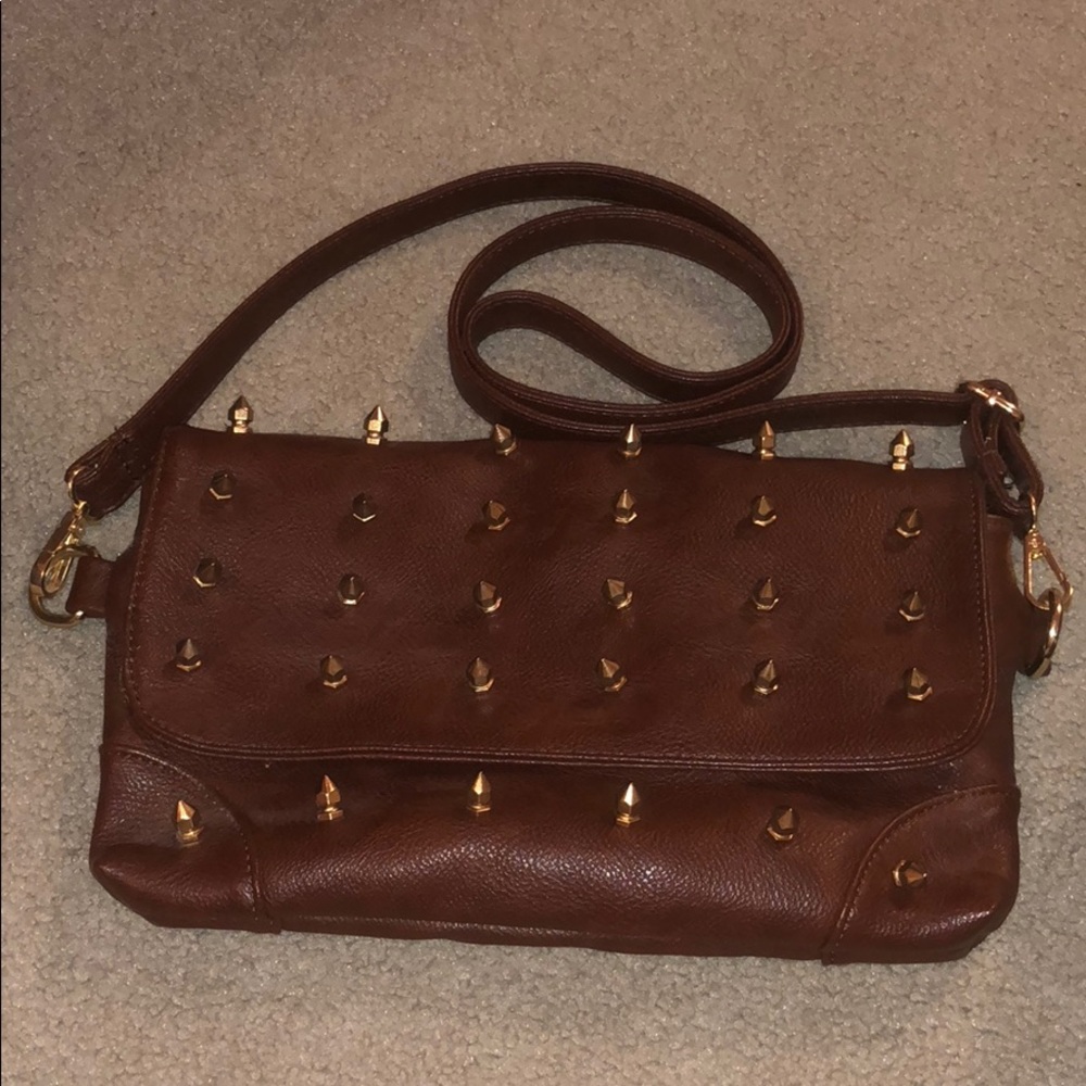 spiked brown purse with floral interior